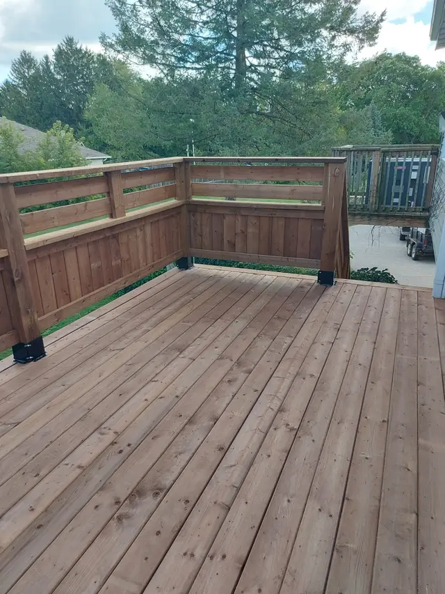 Wood deck with a horizontal board railing