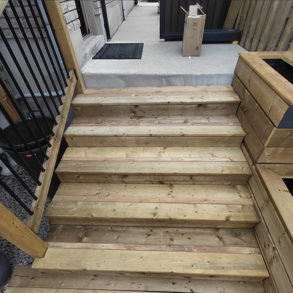 Deck steps with a built-in wood planter box
