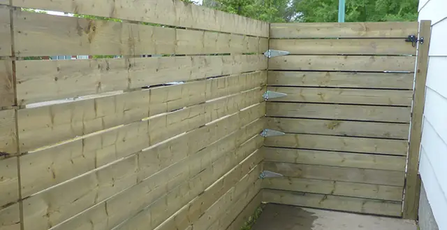 Horizontal wood slat fence with small gaps between boards