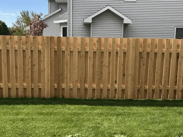 Basic shadowbox fence with boards alternating on both sides of the rails