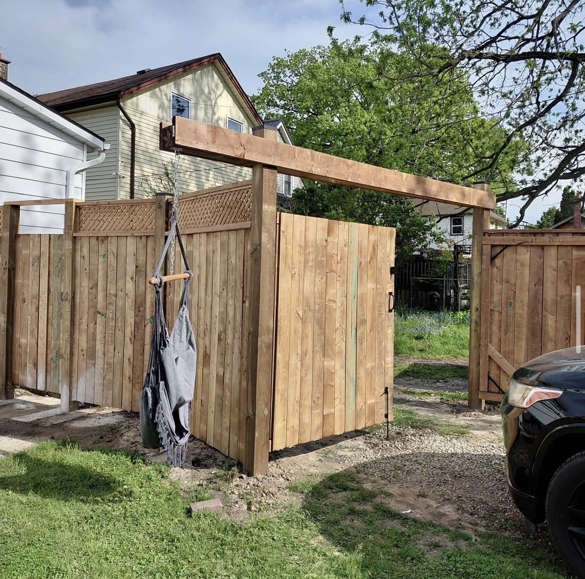 Custom wood gate with curved top